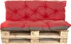 A red and gray cushion set on a wooden pallet. Produktbild-Vorschau