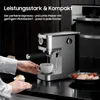 A person is using an espresso machine to make coffee, with a cupcake and a plate of food nearby. Produktbild-Vorschau