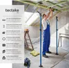 A man is using telescopic support poles to hold up a ceiling structure in a room under construction. Náhled obrázku produktu