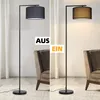 A split image showing a floor lamp in two states: off and on, placed next to an armchair in a living room setting. Produktbild-Vorschau