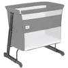 A gray baby crib with white mesh sides, shown from a side-angle. Anteprima dell’immagine prodotto