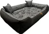 A dog bed with a patterned interior and solid dark exterior. Náhled obrázku produktu