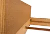 A close-up view of a bed frame with a woven headboard and wooden support structure. Produktbild-Vorschau