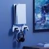 A white wall mount for a Playstation 5 console, controllers, and headphones. Náhľad obrázku produktu