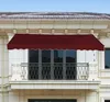 A burgundy awning is installed on a balcony of a building. Podgląd zdjęcia produktu