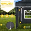 A black pop-up gazebo with a window, set up on a grassy lawn with rain falling. Produktbild-Vorschau