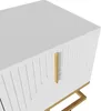 A close-up, angled view of a white lowboard with gold accents and a textured front. Produktbild-Vorschau