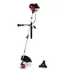 A gasoline-powered string trimmer with a cutting blade and a spare blade shown separately, all on a white background.
