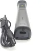 A close-up, angled view of a Philips electric trimmer and its charging cable, set against a white background. Produktbild-Vorschau