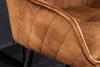 Close-up of a brown quilted armchair armrest with black legs visible in the background. Produktbild-Vorschau
