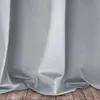 A close-up view of a light gray curtain draped over a wooden floor. Náhľad obrázku produktu