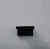 A black fixture mounted on a light gray wall. Náhled obrázku produktu
