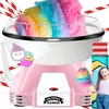 A pink and white cotton candy machine with rainbow-colored cotton candy, paper straws, a scoop, and a sticker of cute characters. A young girl is partially visible on the right, holding a stick with cotton candy. Produktbild-Vorschau