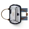 The image shows the inside of a small Cabaïa rucksack, with a notebook, pen, and phone visible. Produktbild-Vorschau
