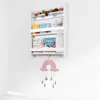A white wall-mounted shelf with books and decorative items. Podgląd zdjęcia produktu