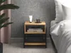 A bedside table next to a bed in a bedroom. Produktbild-Vorschau