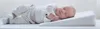 A newborn baby sleeping on a wedge pillow. Náhľad obrázku produktu