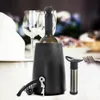 A wine set including a wine cooler, a corkscrew, and a vacuum pump, set on a table with wine glasses and blurred floral background. Náhled obrázku produktu
