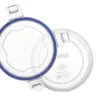 Two clear plastic lids with blue rubber seals, shown from a top-down diagonal angle against a white background. Náhled obrázku produktu