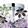 Close-up of a chrome ceiling lamp with acrylic glass flowers in various colors. Náhled obrázku produktu