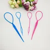 Four hair styling tools are arranged on a white background, with a bouquet of flowers in the upper background. Produktbild-Vorschau