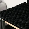A close-up view of a black, textured surface, possibly a cat tree or furniture. Anteprima dell’immagine prodotto