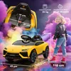 A child is standing next to a yellow toy car, with a close-up of the car's interior and dimensions overlaid. Produktbild-Vorschau