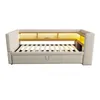 A beige sofa bed with integrated shelving and LED lighting. Anteprima dell’immagine prodotto