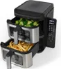 A dual-basket air fryer with food in both baskets. Anteprima dell’immagine prodotto
