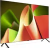 A television screen displaying abstract, colorful shapes. Produktbild-Vorschau