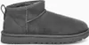 A single gray UGG boot is shown from the side against a white background. Voir les images du produit