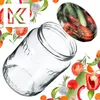 A glass jar is shown tilted, surrounded by various fresh vegetables and herbs, with a logo in the top left corner. Anteprima dell’immagine prodotto