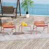 A patio set with two chairs and a table on a wooden deck overlooking the ocean. Náhled obrázku produktu