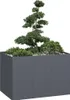 A modern, rectangular planter filled with plants and decorative stones, set against a white background. Produktbild-Vorschau