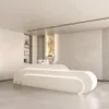 A modern reception desk in a clean, minimalist interior. Produktbild-Vorschau