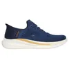 A side view of a blue Skechers slip-on sneaker with gold accents and a white sole. Voir les images du produit