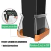 Close-up of a black chair leg being fitted into a clear silicone and cork furniture protector. Produktbild-Vorschau