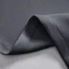 A close-up view of the texture and stitching of a gray fabric, likely a curtain. Produktbild-Vorschau