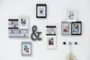A wall display featuring LEGO-themed photo frames and display cases with small figurines. Anteprima dell’immagine prodotto