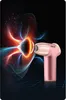 A pink and gold massage gun is shown against a dark background with abstract, colorful energy waves emanating from its head. Produktbild-Vorschau