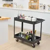 A black two-tier rolling cart filled with bottles and jars, placed in a modern kitchen setting. Podgląd zdjęcia produktu