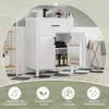 A white bathroom vanity with an open cabinet revealing bottles and wine bottles, set against a tiled wall and floor. Icons with text are displayed at the bottom. Podgląd zdjęcia produktu