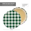 A close-up view of a green and white checkered jar lid, with a partial view of the inside of the lid. Produktbild-Vorschau
