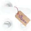 A white door handle set with a round rosette and a toilet lock mechanism, with a product tag attached. Produktbild-Vorschau