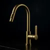 A close-up studio shot of a gold kitchen faucet against a black background. Produktbild-Vorschau
