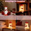 Collage of a ghost-shaped lamp in different settings, including near a Christmas tree, on a bookshelf, and on a nightstand. Produktbild-Vorschau