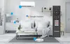 A living room scene with a couch, coffee table, air conditioner, and a robot vacuum cleaner, all connected by lines to Google Assistant. Produktbild-Vorschau