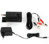 A collection of electronic components for a BBQ grill motor, including the motor itself, a power adapter, and connecting cables with alligator clips. Náhled obrázku produktu