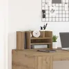 A desk organizer with books, a clock, and a plant on a wooden desk. Voir les images du produit