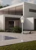A white outdoor lamp post stands in front of a modern white house with large windows, next to a swimming pool. Anteprima dell’immagine prodotto
